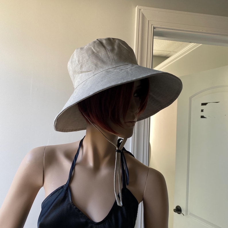 natural linen wide brim hat on mannequin