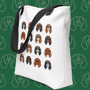 May include: White canvas tote bag with black handles and a repeating pattern of brown and black Cavalier King Charles Spaniel dog faces.