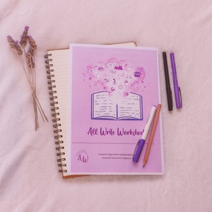 May include: A pink and purple worksheet titled "All Write Worksheet" with a drawing of an open book and a cloud of colorful icons. The worksheet is on a white surface with a spiral bound notebook, a pencil, and three pens.
