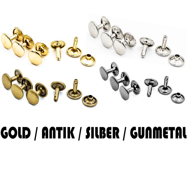 May include: Assortment of metal rivets in gold, antique brass, silver, and gunmetal finishes. The rivets are in various stages of assembly, with some having the top and bottom pieces attached and others having the post attached.