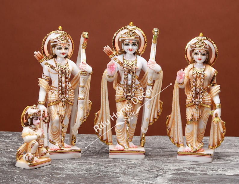 May include: White marble statue set of the Hindu deities Rama, Sita, Lakshmana, and Hanuman. The statues are intricately carved and painted with gold accents. The set is a beautiful representation of the Ramayana epic.