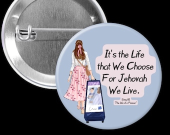 May include: A round button with a pin back. The button features an illustration of a woman in a pink floral skirt and the text "It's the Life that We Choose For Jehovah We Live."