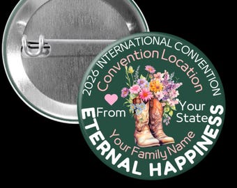 May include: A round, green button with the text "2026 International Convention Location" and "Eternal Happiness". It features a pair of cowboy boots filled with flowers and a pink heart. The button is made of metal.