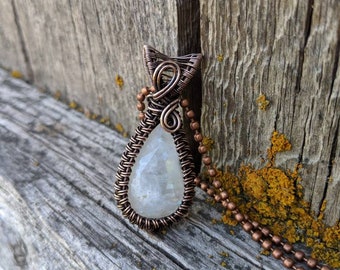 White labradorite (rainbow moonstone) and copper weaved pendant