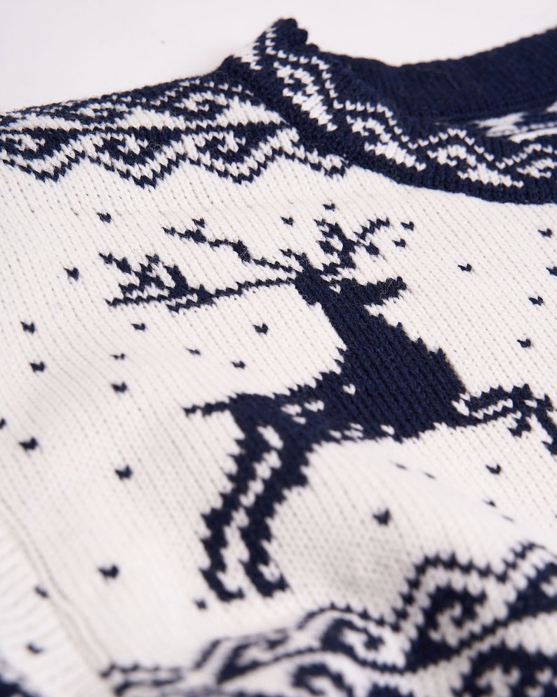 Navy blue oversized Christmas sweater with reindeers winter design for men made of wool