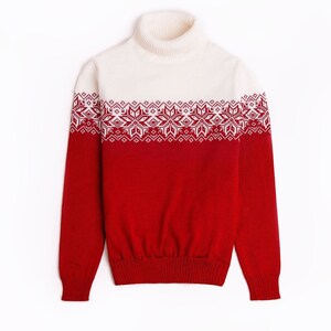 May include: A red and white turtleneck sweater with a snowflake pattern.