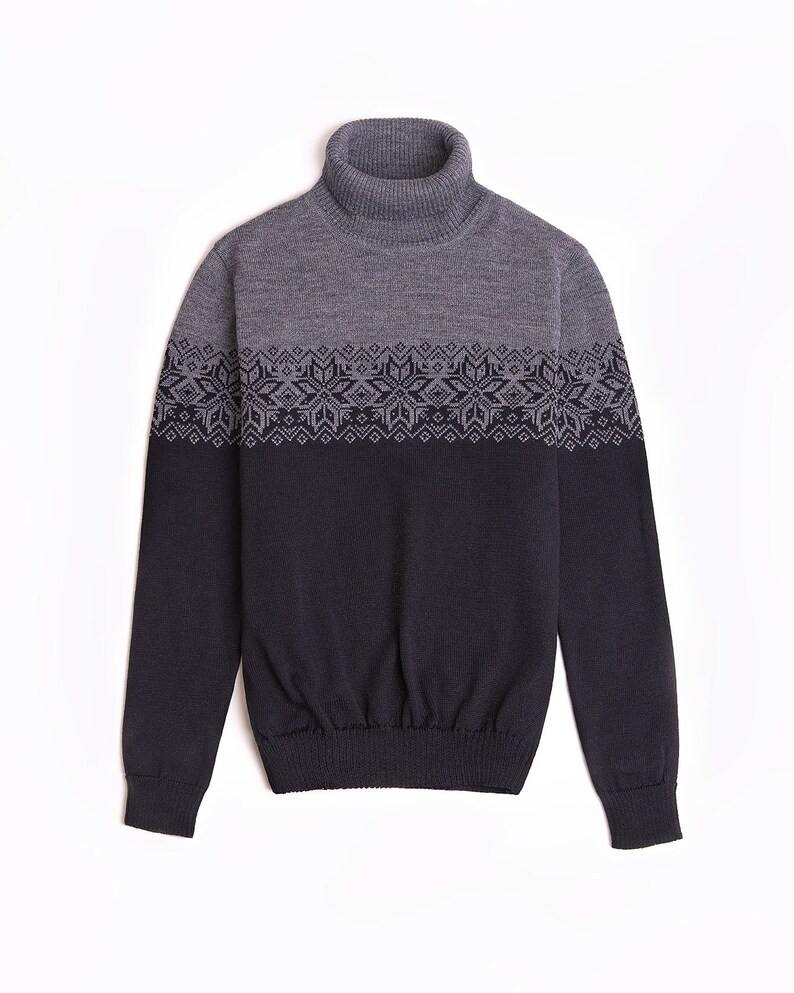 May include: A gray and black turtleneck sweater with a geometric pattern around the chest.
