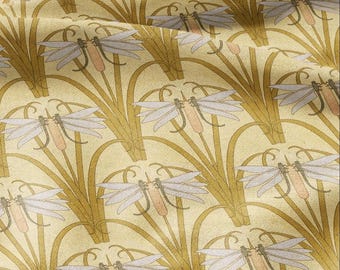 May include: A beige fabric with a repeating pattern of stylized dragonflies in shades of light blue and brown. The dragonflies are perched on top of stylized reeds in a golden yellow color.