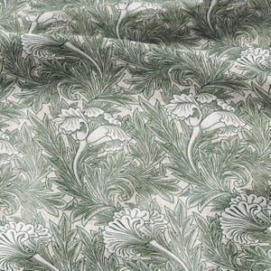 Puede incluir: Un patrón sin costuras con un diseño repetitivo de hojas verdes estilizadas y flores blancas. El patrón recuerda al estilo Art Nouveau.