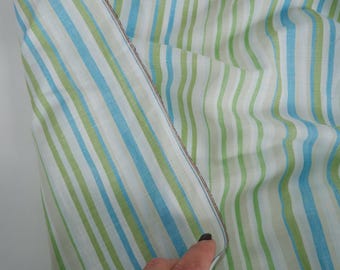 May include: Striped fabric in shades of green, blue, and white. The fabric is folded over, showing the reverse side.