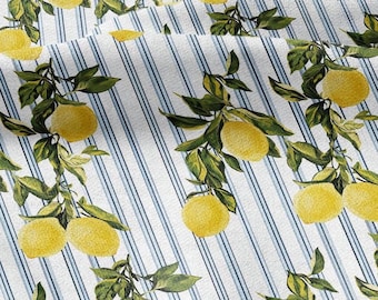 May include: Fabric with a repeating pattern of yellow lemons and green leaves on branches, set against a white background with blue vertical stripes. The design has a fresh, summery feel.