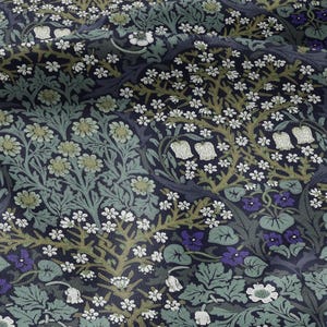 May include: A fabric with a floral pattern in shades of navy, green, and white. The design features stylized flowers, leaves, and vines. The overall aesthetic is reminiscent of vintage botanical illustrations.