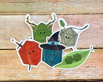 May include: Five colorful dice stickers with cute faces. The dice are green, gray, red, blue, and green. The stickers are perfect for adding a touch of whimsy to any project.