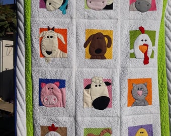 Handmade quilt with applique animals brighty colors