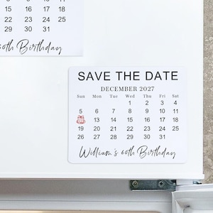 May include: Two rectangular white magnetic calendars for December 2027, each featuring the text SAVE THE DATE, a calendar grid, a small red gift icon on the 5th, and the script text William's 60th Birthday at the bottom of each calendar.