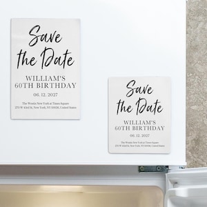 May include: Two rectangular white magnets with black text reading Save the Date, William's 60th Birthday, 06.12.2027, and The Westin New York at Times Square, 270 W 43rd St, New York, NY 10036, United States, displayed on a white refrigerator door.