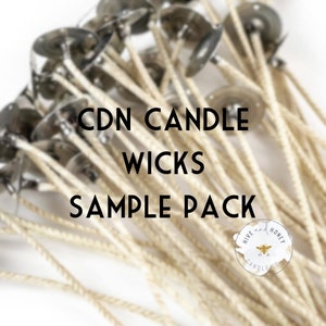 May include: A close-up of a bundle of white candle wicks with metal bases. The text "CDN CANDLE WICKS SAMPLE PACK" is printed in black on a white background. A small logo with the text "HIVE AND HONEY CANDLE CO." is visible in the lower right corner.