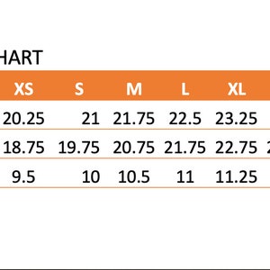 May include: Size chart for clothing with measurements in inches for length, width, and sleeve length. Sizes include XS, S, M, L, XL, and 2XL.