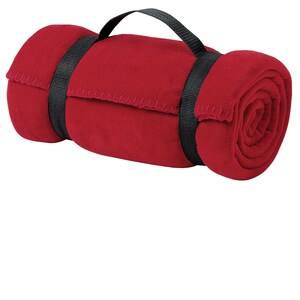 a rolled up red towel on a white background