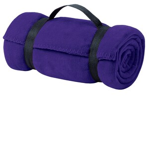 a rolled up purple towel on a white background