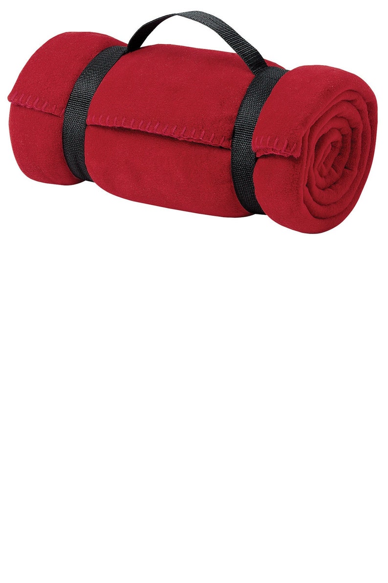 a rolled up red towel on a white background