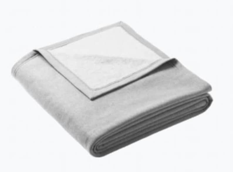 a white blanket folded on top of each other