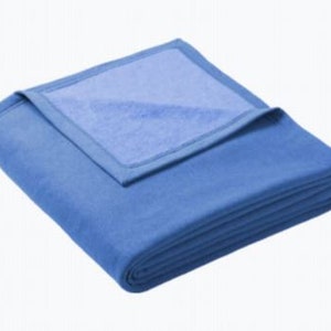 a blue blanket folded on top of each other