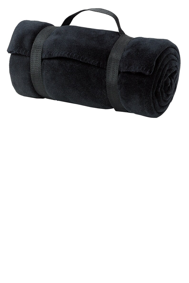 a rolled up black towel on a white background