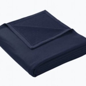 a blue blanket folded on top of each other