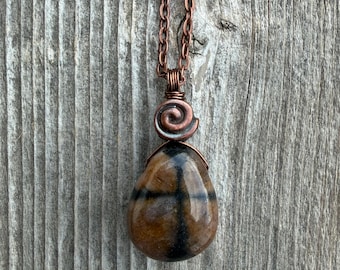 Chiastolite (Andalusite) for Protection and Rebirth with Copper Accents. Swirl to Signify Consciousness.