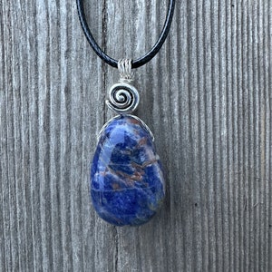 Sodalite - Known as The Poets’ Stone for Increasing Creativity and Inspiration. Swirl to Signify Consciousness.