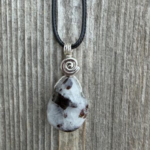Siderite in Cryolite for Opening Chakras, Awakening Intuition and Psychic Abilities. Swirl Signifies Consciousness.