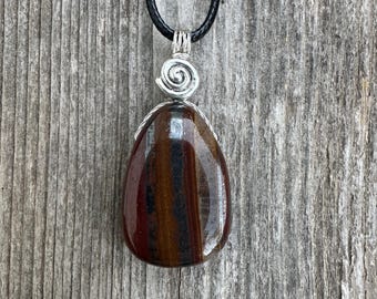 Tiger Iron Pendant for Vitality and Support Through Transitional Periods. Swirl Signifies Consciousness