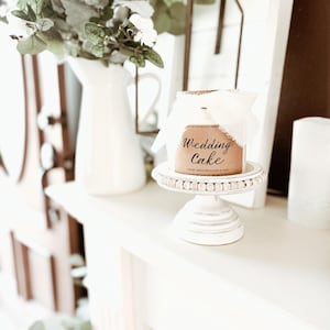 May include: A set of three ceramic mugs with a speckled, matte finish. The mugs are in shades of cream, light gray, and dark gray. Each mug has a simple, minimalist design, perfect for coffee or tea.