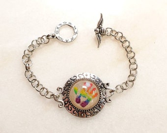 Supernatural RAINBOW CASTIEL HANDPRINT watch style bracelet with Bee toggle. Custom sized for you. :-)