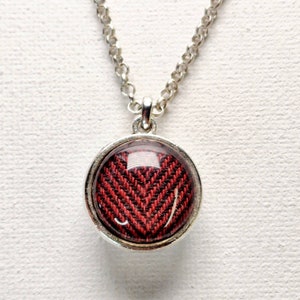 SUPERNATURAL petite BABY doublesided necklace made from screen accurate Sam and Dean Winchester Shirts. Herringbone cut. Silver toned.