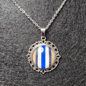 SUPERNATURAL CASTIEL colors NECKLACE. Fancy version, rhodium silver tone.