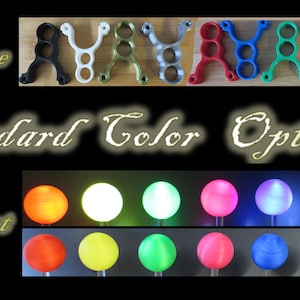 May include: Image showcasing a variety of slingshot frames in different colors, including black, white, green, silver, red, blue, and brown. Below, a display of radiant orbs in various colors, such as orange, white, green, pink, and blue, are shown. The text "Opaque", "Standard Color Options", and "Radiant" are also visible.