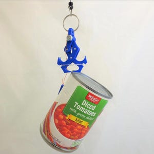 May include: A blue 3D-printed can lifter holds a can of diced tomatoes with green chiles. The can is silver with a green and white label. The can weighs 10 oz (283 g). The lifter is attached to a metal ring.