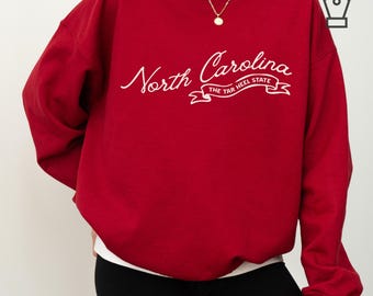 Sudadera de Carolina del Norte, cuello redondo, estilo informal, inspirada en el estado de Tar Heel.