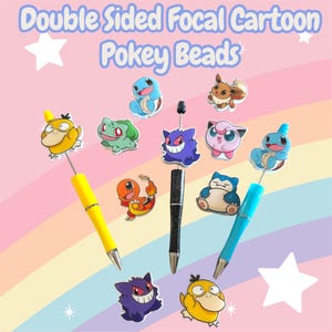 May include: Pens with cartoon character toppers. The pens are yellow, black, and blue. The toppers feature various cartoon characters. The background is a pastel rainbow with the text "Double Sided Focal Cartoon Pokey Beads".
