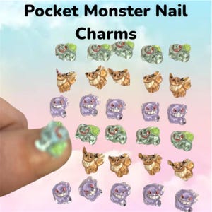 May include: Pocket Monster Nail Charms. Assortment of nail charms featuring various cartoon characters in green, brown, and purple. The charms are small and three-dimensional, with a glossy finish. The background is a gradient of pink and blue.