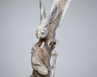 Carved owl figurine (rabbit hunting)