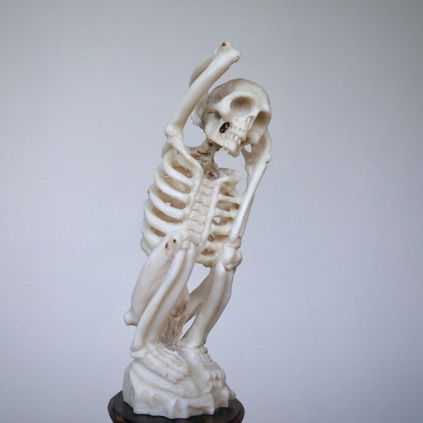 Carved skeleton figurine of deer antler