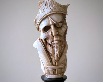 Human skull carving of deer antler