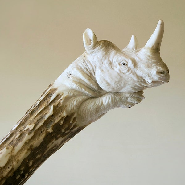 Knife handle of deer antler, Carved rhinoceros