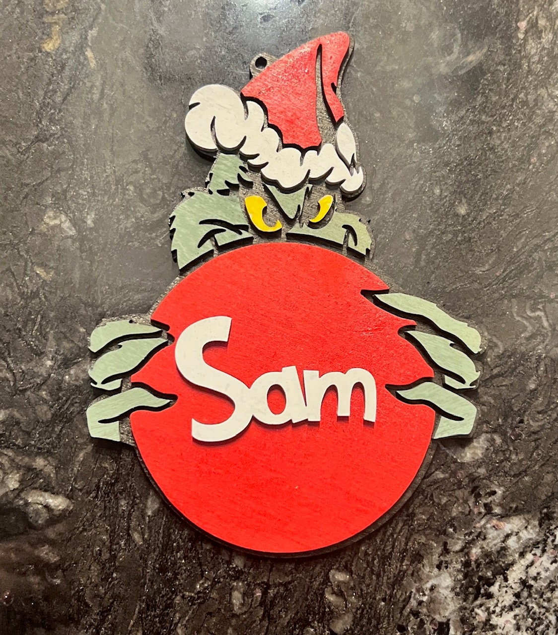 Grinch Holding an Ornament Etsy