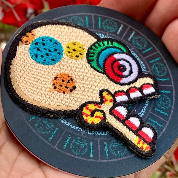 Miquiztli-strijkpatch + sticker