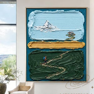 May include: A large rectangular textured oil painting featuring a light blue sky with a white mountain peak and a small house, a horizontal gold band, and a dark green landscape with a winding path and a small hiker figure in a blue backpack.