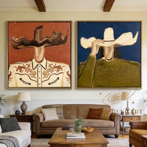 May include: Two framed abstract paintings. One features a figure in a white shirt with brown embroidery and a brown hat against a red background. The other shows a figure in a green shirt and a white hat against a blue background.